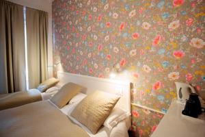 Postel nebo postele na pokoji v ubytování Hotel Bencidormi