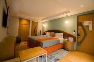 Ένα ή περισσότερα κρεβάτια σε δωμάτιο στο Hotel Catalina