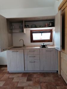 Kuchyň nebo kuchyňský kout v ubytování Casa La Liccia