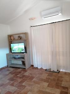 TV a/nebo společenská místnost v ubytování Casa La Liccia