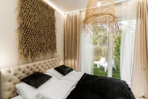 Katil atau katil-katil dalam bilik di Apartament Black