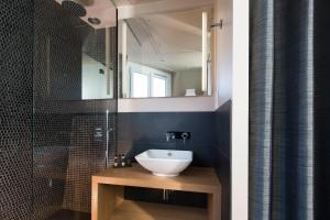 a bathroom with a sink and a shower and a mirror at Best Western Quartier Latin Pantheon in Paris