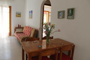 a living room with a table and a couch at Michael Apartments in Rethymno