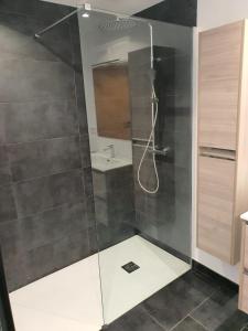a shower with a glass door in a bathroom at Villa Cala Blanca in Alcossebre