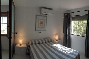 Ένα ή περισσότερα κρεβάτια σε δωμάτιο στο Villa Sina
