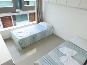 En eller flere senger på et rom på apartamento 2 quartos em Porto segur BA