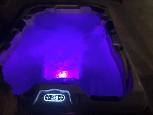an alarm clock on the back of a car with purple lights at Dammuso U Granatu in Pantelleria