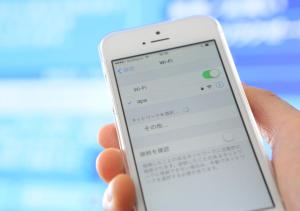 a person holding a cell phone in their hand at APA Hotel Namba Shinsaibashi Nishi in Osaka