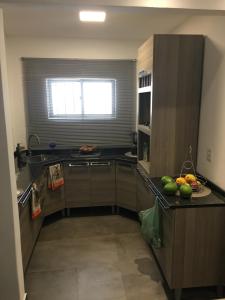 a kitchen with a counter with fruit on it at Guest Apartment Paulo in Recife +32 photos