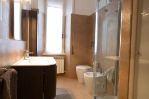 a bathroom with a shower and a sink and a toilet at Civico11 in Ancona +19 photos