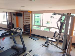 a gym with two tread machines in a room at Apartamento de 2 quartos com pé na areia em Manaíra in João Pessoa