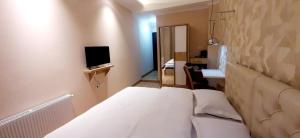 TV a/nebo společenská místnost v ubytování Happy Stay Hotel