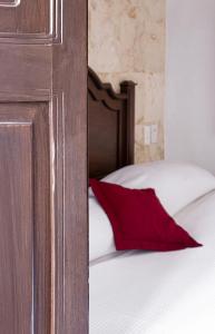 Postel nebo postele na pokoji v ubytování La Aurora Hotel Colonial