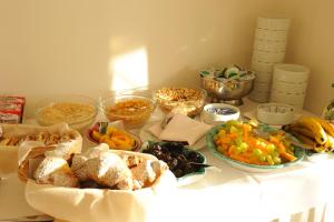 a table topped with lots of different types of food at Hotel Villa Fraulo in Ravello