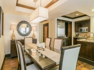 a kitchen and dining room with a table and chairs at Luxurious 3 Bedroom With Ski in & out Access condo in Truckee