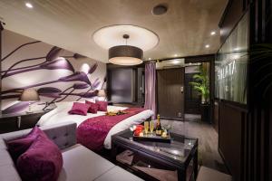 a hotel room with a bed and a couch at HOTEL SULATA GIFU HASHIMA (Adult Only) in Hashima +62 photos