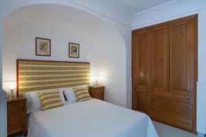 Postel nebo postele na pokoji v ubytování Maresca Hotel Praiano