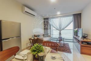 a living room with a table and a dining room at TimurBay Stunning By CA CON in Kuantan