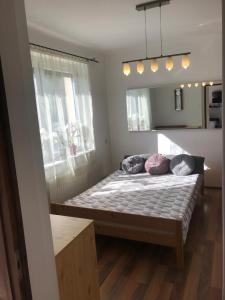 Posteľ alebo postele v izbe v ubytovaní Fatima apartman