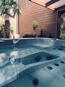 a hot tub in the backyard of a house at Gites N Spa in Tourcoing