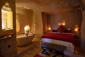 A bed or beds in a room at Sato Cave Hotel