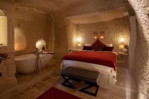 A bed or beds in a room at Sato Cave Hotel