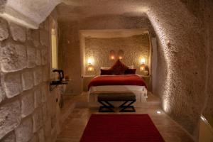 A bed or beds in a room at Sato Cave Hotel