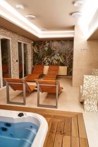 a jacuzzi tub in the middle of a living room at LAGUNA Apartament Polanica Residence 28-SPA in Polanica-Zdrój