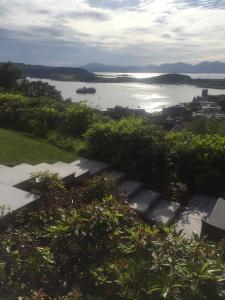 a view of a body of water with a boat in it at Tigh Beag in Oban +9 photos