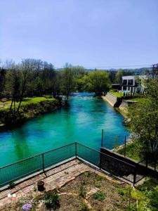 Blick auf einen Fluss mit blauem Wasser in der Unterkunft Holiday home Dream Bosanska Krupa in Bosanska Krupa