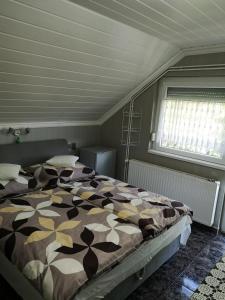 Posteľ alebo postele v izbe v ubytovaní Lake Balaton Apartmanház + 15 fotografií