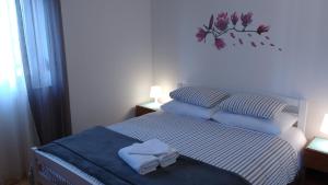 מיטה או מיטות בחדר ב-Lu-Do Apartments