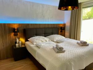 Tempat tidur dalam kamar di Casa Luxe
