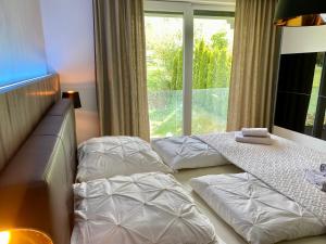 Tempat tidur dalam kamar di Casa Luxe
