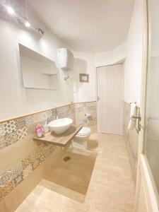 a bathroom with a toilet and a sink in it at La Primavera in Anacapri +20 photos