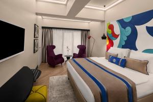 Uma TV ou centro de entretenimento em Sura Hagia Sophia Hotel