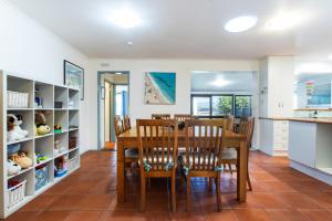 a kitchen and dining room with a table and chairs at Relax in San Remo Pets Welcome in San Remo