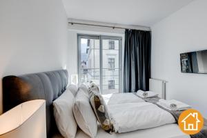 Posteľ alebo postele v izbe v ubytovaní Apartamenty Promenada Gwiazd 28 - visitopl