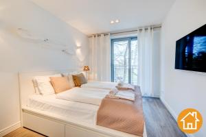 Posteľ alebo postele v izbe v ubytovaní Apartamenty Promenada Gwiazd 28 - visitopl