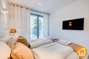 Posteľ alebo postele v izbe v ubytovaní Apartamenty Promenada Gwiazd 28 - visitopl