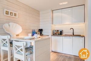 Kuchyňa alebo kuchynka v ubytovaní Apartamenty Promenada Gwiazd 28 - visitopl