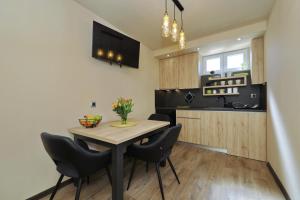 Kuchyňa alebo kuchynka v ubytovaní APARTMAN ZARA