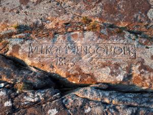 an inscription on a rock with the name vikings annexation at Eimind Feriehus in Eidmind