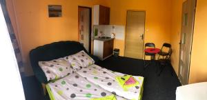 Postel nebo postele na pokoji v ubytování Hotel Na Trojce
