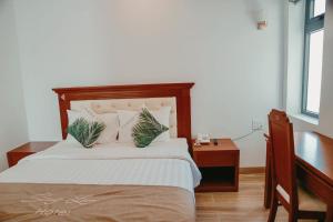 Postelja oz. postelje v sobi nastanitve Lam Hồng Apartment & Hotel