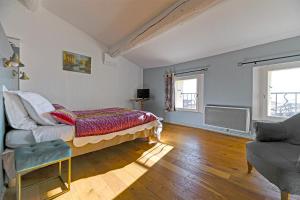 Postel nebo postele na pokoji v ubytování Maison Capucine