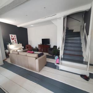 TV a/nebo společenská místnost v ubytování Maison Capucine