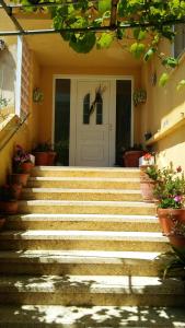 a set of stairs leading to a front door at 2 bedrooms appartement with sea view and wifi at El Grove 1 km away from the beach in O Grove