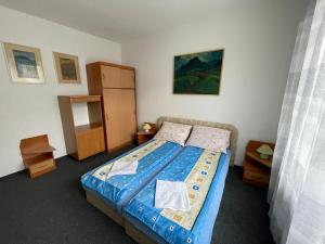Posteľ alebo postele v izbe v ubytovaní Penzión Malý Rím