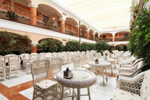 a row of tables and chairs in a building at Hotel Begoña Park in Gijón